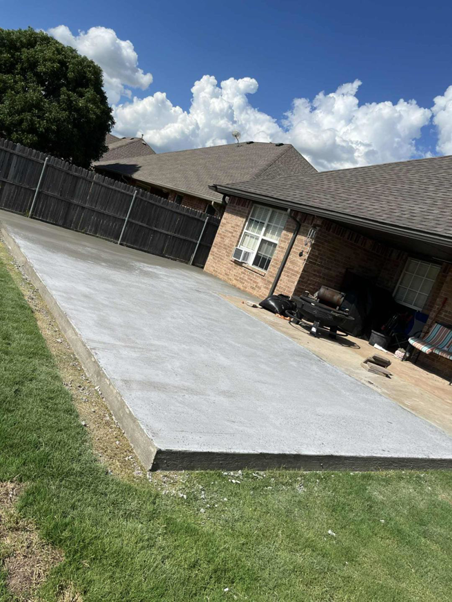 A large newly poured concrete slab installation next to a house by Power concrete in Thousand Oaks, CA.