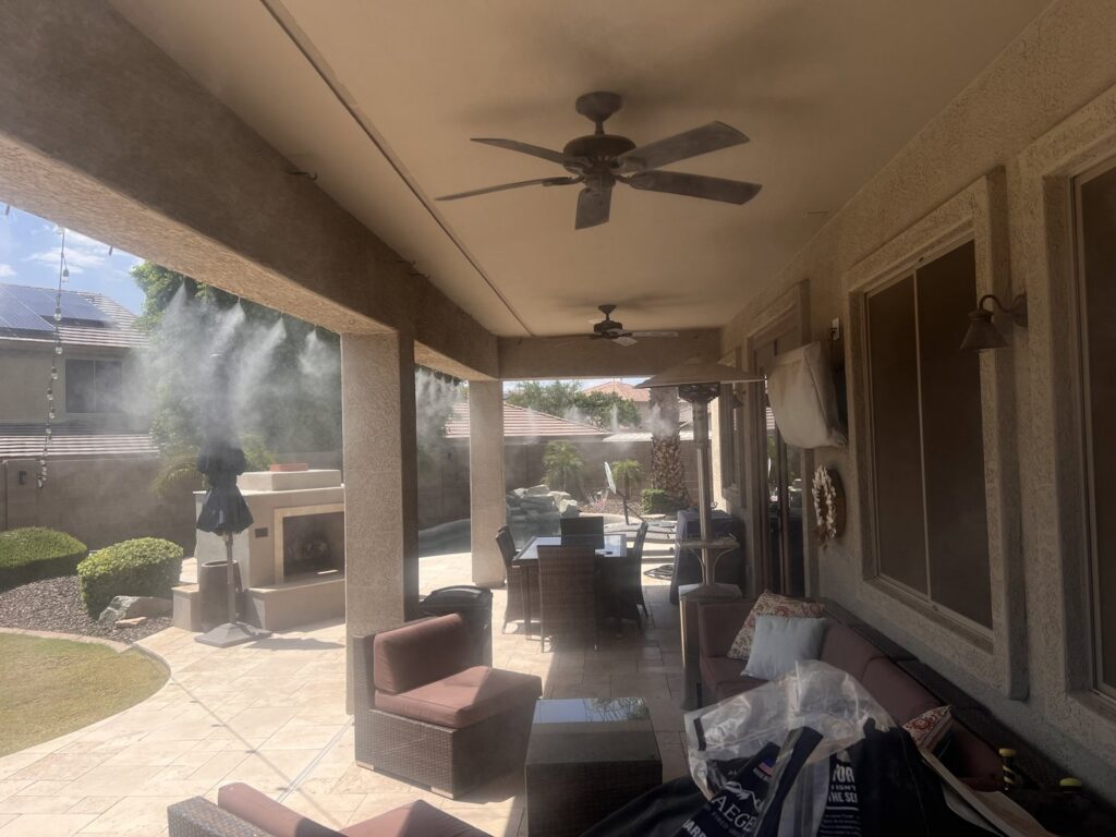 A high-quality mist system installed on a large patio with comfortable outdoor seating by Mr. Mister in Surprise, AZ