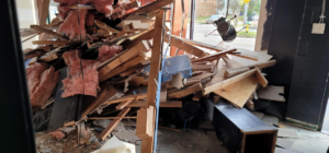 Large pile of construction and demolition debris inside a building, ready for removal by P and P Junk Removal and Demolition in Norfolk, VA.