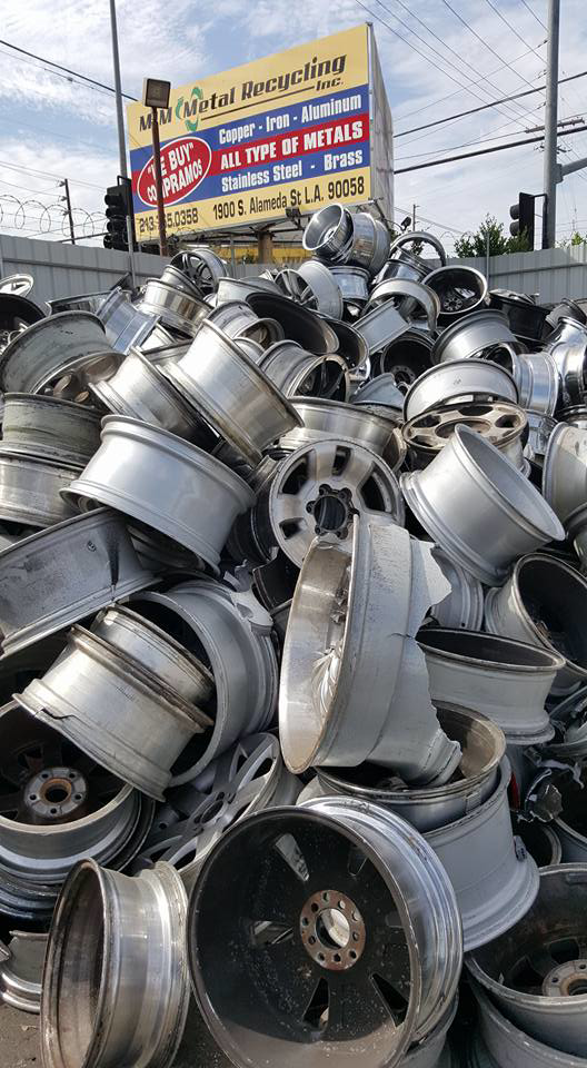 A large pile of aluminum car rims collected for general junk removal by MIM Metal Recycling in Los Angeles, CA.