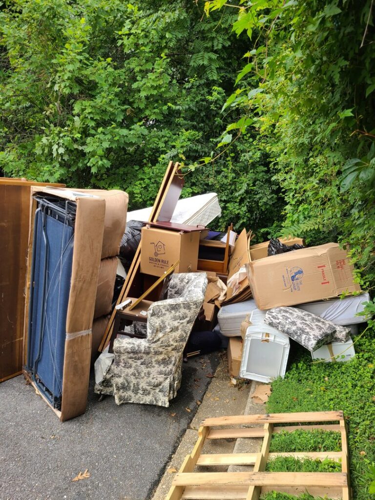 A large pile of furniture and household junk left roadside, awaiting removal by Junk Unlimited Junk Removal in Laurel, MD.