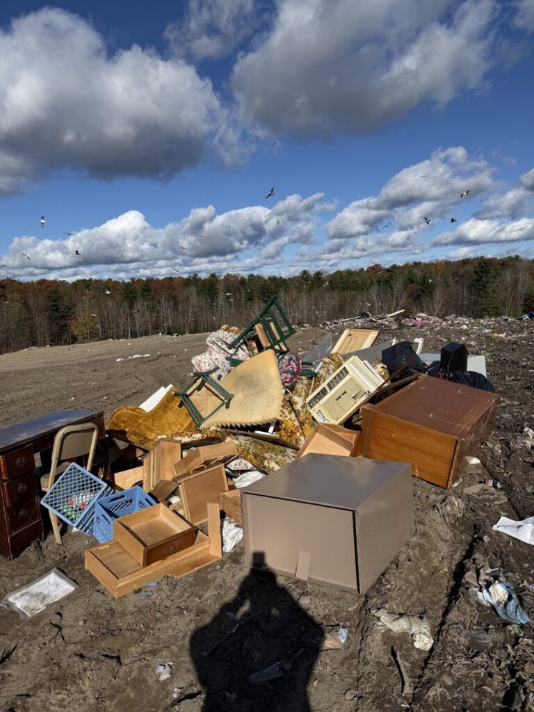 A large pile of various junk, including furniture and appliances, at a landfill after removal by Clutter Bandit in Albany, NY.