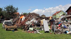 A large pile of various junk and scrap metal in an outdoor yard at Bailey Recycling and Scrap Metal in Topeka, KS