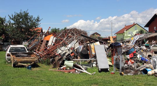 A large pile of various junk and scrap metal in an outdoor yard at Bailey Recycling and Scrap Metal in Topeka, KS