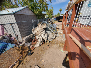 A large pile of mixed junk, including metal, fabric, and construction debris, ready for removal by V.S.C Junk Removal Services in Las Vegas, NV.