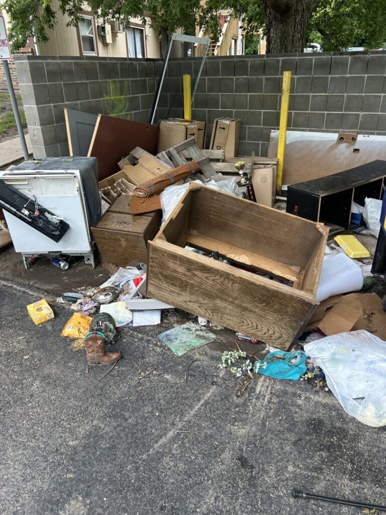 A large pile of outdoor junk, including furniture and appliances, ready for removal by The Goat Junk Removal in Ankeny, IA