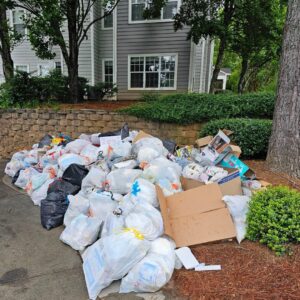 A large pile of trash bags and cardboard boxes awaiting junk removal by Veterans Easy Trash: Atlanta in Atlanta, GA.