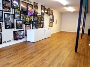 A spacious room featuring newly installed wood-look flooring, part of a renovation by Stormtroopers Home Improvement in Port St. Lucie, FL.