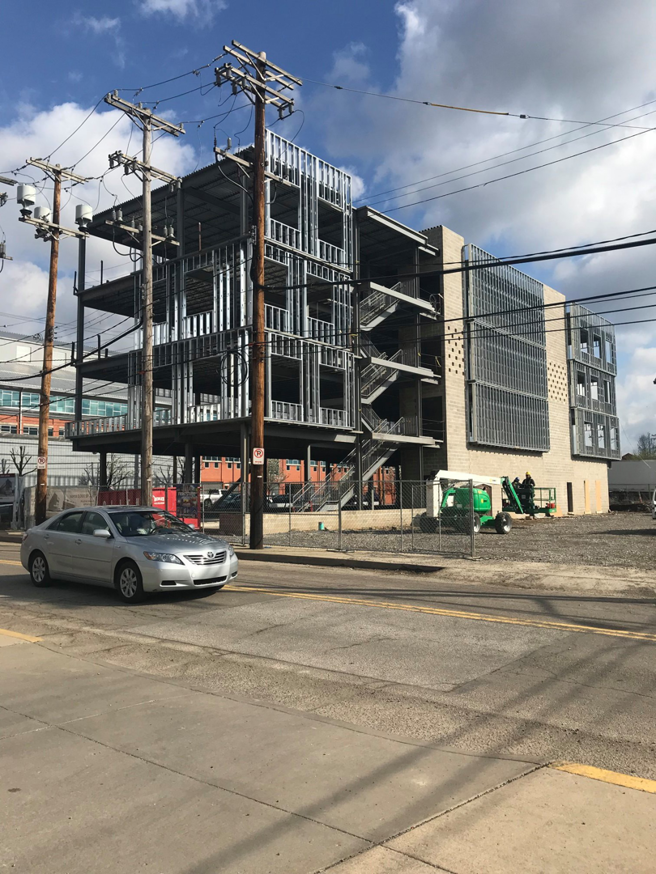 A large-scale construction project with steel and concrete structures underway by J S Construction in Finleyville, PA