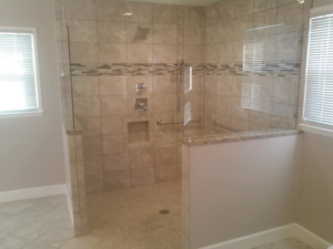 A spacious walk-in shower with glass panels and tiled walls, completed by Paulus Contracting in Fayetteville, OH
