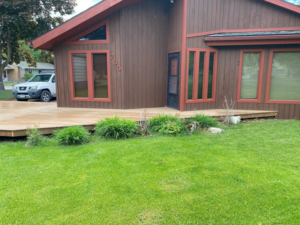 Large wooden deck construction around a house by Handyman Robert in Columbia Falls, MT.