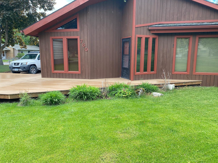 Large wooden deck construction around a house by Handyman Robert in Columbia Falls, MT.