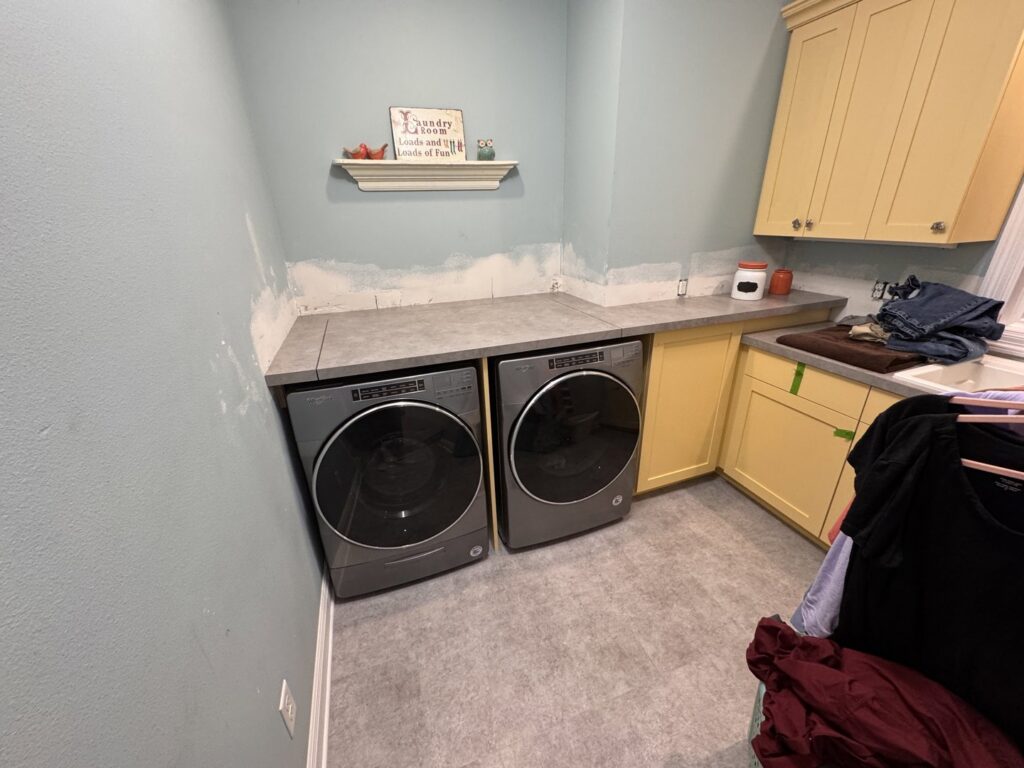 A laundry room with new appliances and countertops installed by Hawk Handyman Services in West Fargo, ND