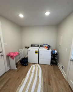 A laundry room before renovation, showing the space where Odd Jobs of Bowling Green performed handyman services in Bowling Green, KY.