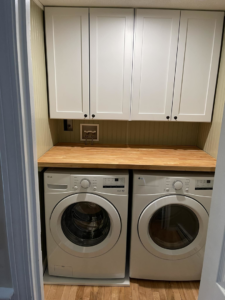 Professional laundry room cabinet and countertop installation by Friendly Neighborhood Handyman in Uxbridge, MA.