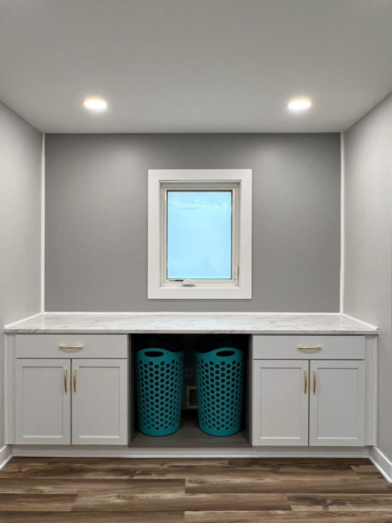 Newly installed laundry room cabinets and countertop by SMB Construction in Toledo, OH.