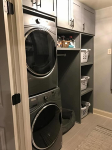 Newly installed laundry room cabinets and shelving by Hollis Construction in Nashville, TN.