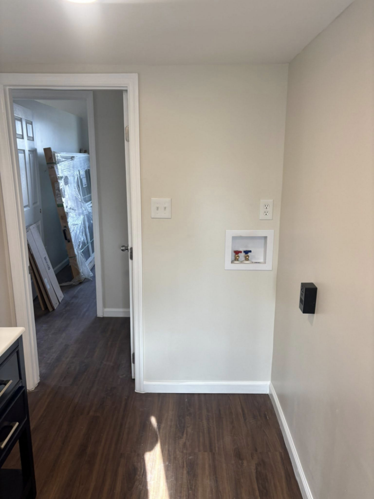 A laundry room area with new washing machine hookups installed by Fox Renovations in Knoxville, TN