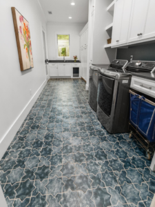 Completed laundry room remodel with tile flooring and cabinets by Patat Building & Remodeling, Inc. in Monroe, GA