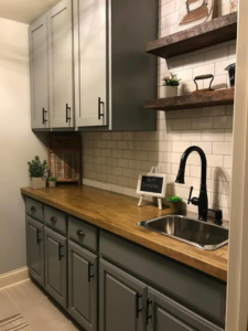 Complete laundry room renovation featuring new cabinets and countertop by Hollis Construction in Nashville, TN.