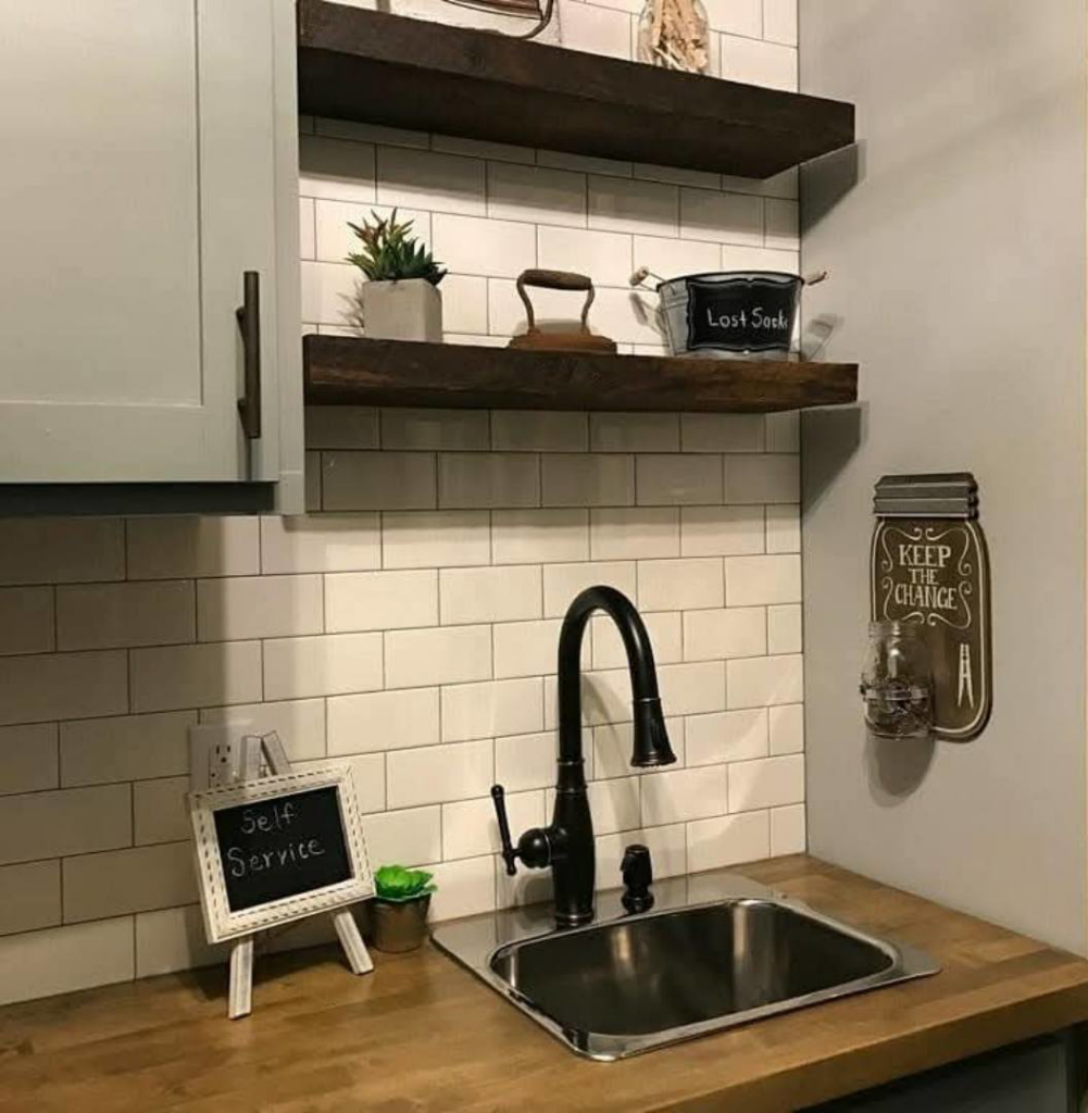 Modern laundry room sink, faucet, and subway tile backsplash installed by Hollis Construction in Nashville, TN.