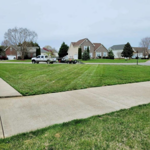 A truck and trailer with professional lawn care equipment from Home and Land Services in Clarksville, TN