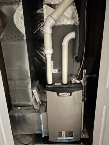 A Lennox furnace and air handler unit installed in a utility closet by Cold Comfort HVAC Services, LLC in Rockville, MD.