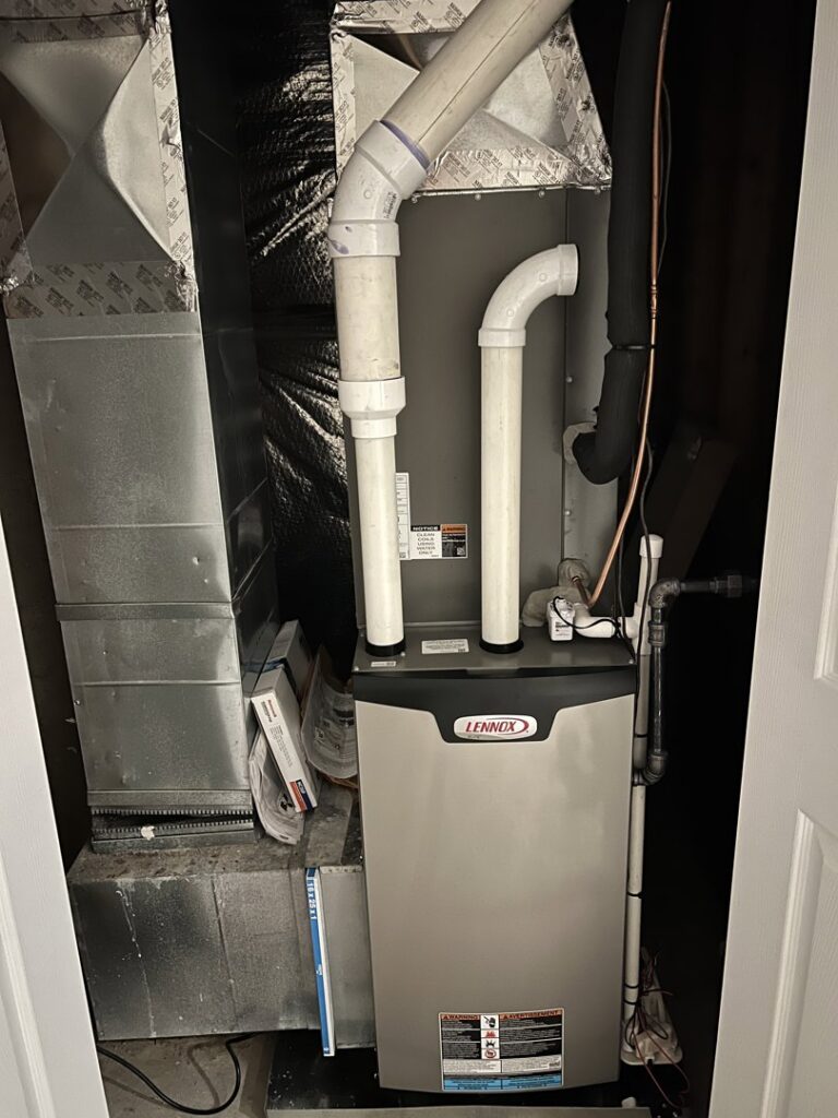 A Lennox furnace and air handler unit installed in a utility closet by Cold Comfort HVAC Services, LLC in Rockville, MD.
