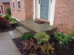 A beautifully leveled concrete porch and steps, showcasing a successful concrete repair by A1 Concrete Leveling Cincinnati/NKY in Cincinnati, OH.