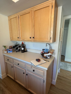 Light wood kitchen cabinets and countertop before refinishing by Cabinet Refinishing Northwest in Beaverton, OR.