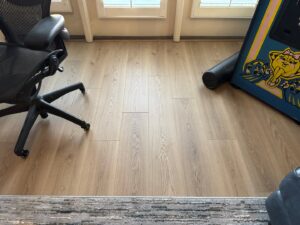 Light wood laminate flooring installation completed by Santizo Flooring & Painting in Raleigh, NC.