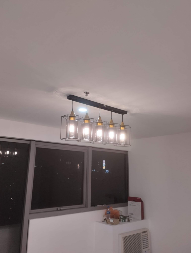 A linear pendant light fixture with multiple bulbs installed by Electrician on Call and Home Service in Taguig, PH.