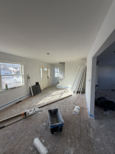 Living area flooring and trim installation services by Building Better Homes Management in Cincinnati, OH.