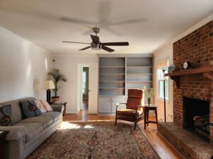 Living room with custom built-in shelves and a ceiling fan installed by KC's Improvement & Construction Co., Inc. in Greensboro, NC