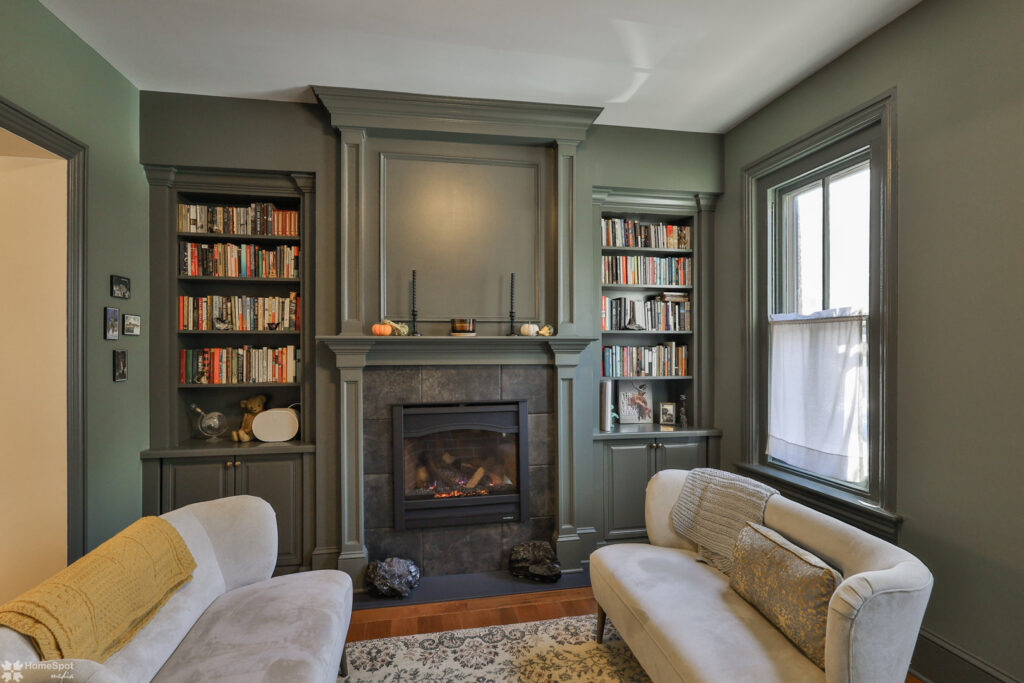 A renovated living room featuring a fireplace and custom built-in bookshelves by Shafer Construction, LLC in Bethlehem, PA.