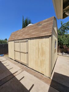 A beautifully remodeled living room featuring a large stone fireplace by VDO. Remodeling in Rancho Cordova, CA.