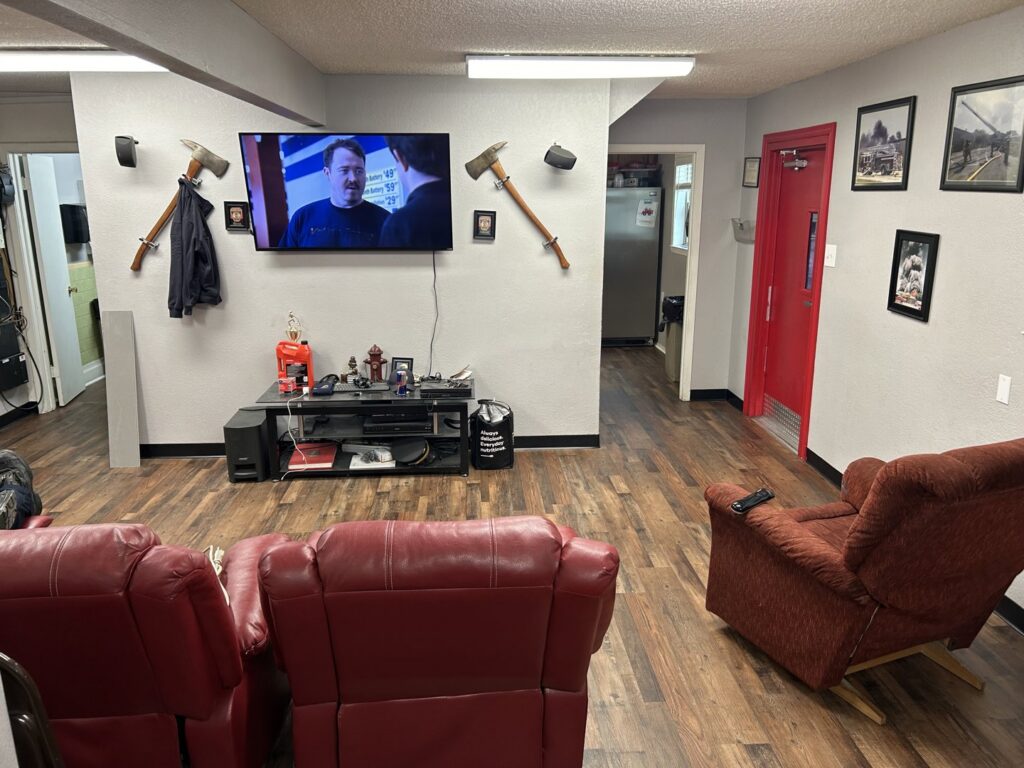 Completed wood-look flooring installation in a comfortable living room by MDN Roofing 2 Flooring LLC in Fort Worth, TX.