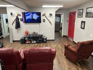 Completed wood-look flooring installation in a comfortable living room by MDN Roofing 2 Flooring LLC in Fort Worth, TX.