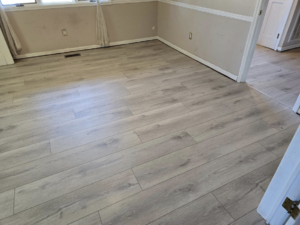 Beautiful new light hardwood flooring installed in a living room by Refined Hardwood Flooring LLC in Wilmington, NC