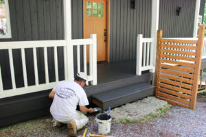 A freshly painted living room with hardwood floors and a fireplace, completed by Brush N' Roll Painting Co. in Federal Way, WA.