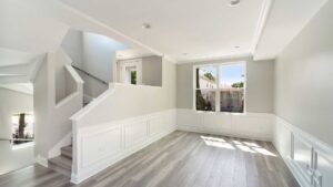A renovated open-concept living room and kitchen area, completed by ETI Construction in Chicago, IL.