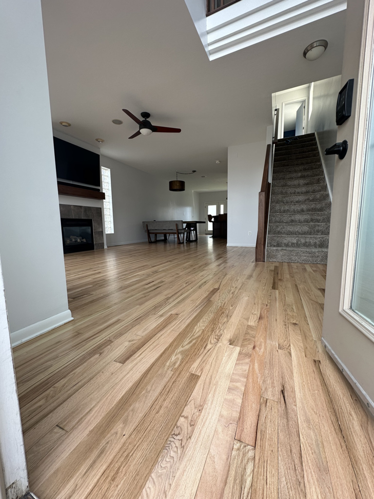 Living room light wood floor refinishing by Sandman Wood Floor Refinishing in Cleveland, OH.