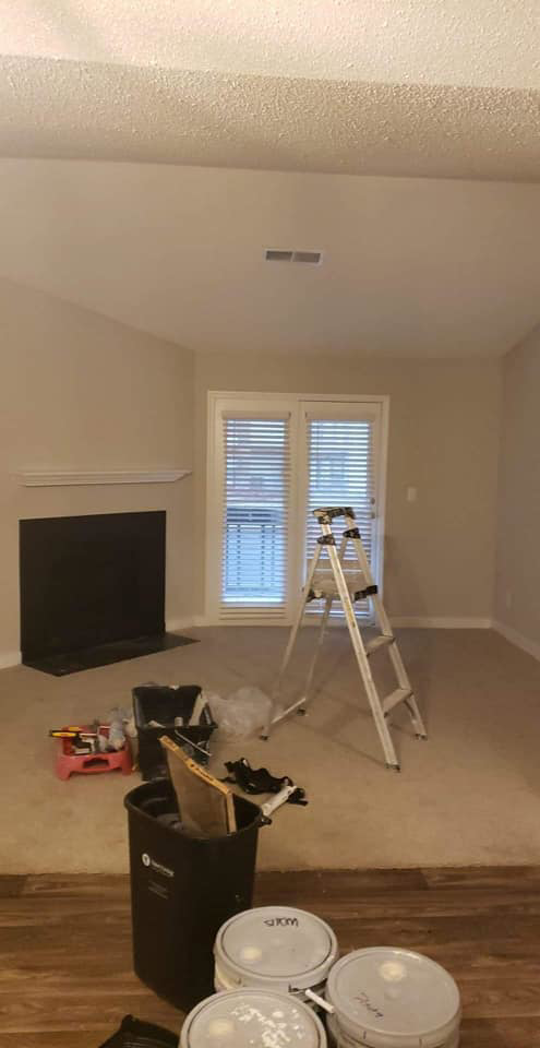 Living room painting and renovation work by Sanchez Construction in Weimar, TX