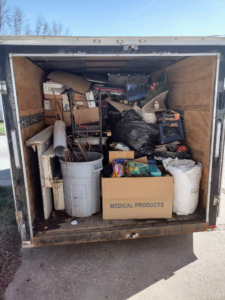 A loaded junk removal trailer filled with various items by You Call We'll Haul in Waterloo, IA.