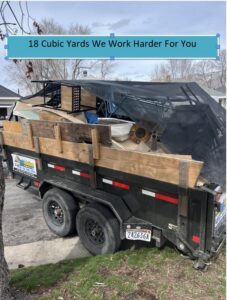 A large 18 cubic yard trailer from Junk Solutions loaded with wood and debris, ready for removal in Ogden, UT.