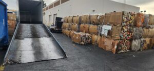 A loading dock with baled cardboard and plastic waste at RENUOil Of America, INC in Las Vegas, NV