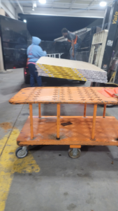 Workers loading drywall sheets onto a truck for a handyman or remodeling job by Cleaning Solutions & Remodeling Services LLC in Shreveport, LA.