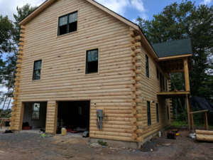 Exterior view of a log cabin style house under construction by JON Construction, Inc. in Allentown, PA.