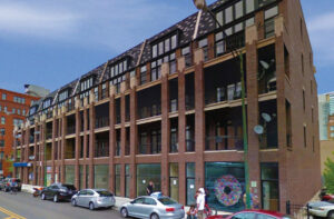 A long brick apartment building exterior, a completed residential project by 3F Construction in Chicago, IL.