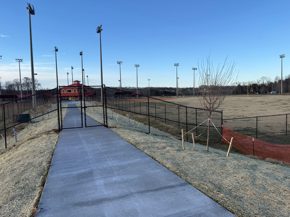 A long chain-link fence installed around a sports complex by Tim's Fencing in Knoxville, TN.